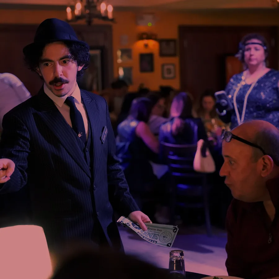 A Murder Mystery Company actor working the room at a Washington show